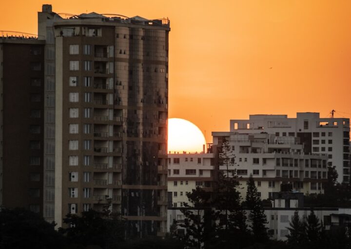 silhouette of city buildings during sunset
